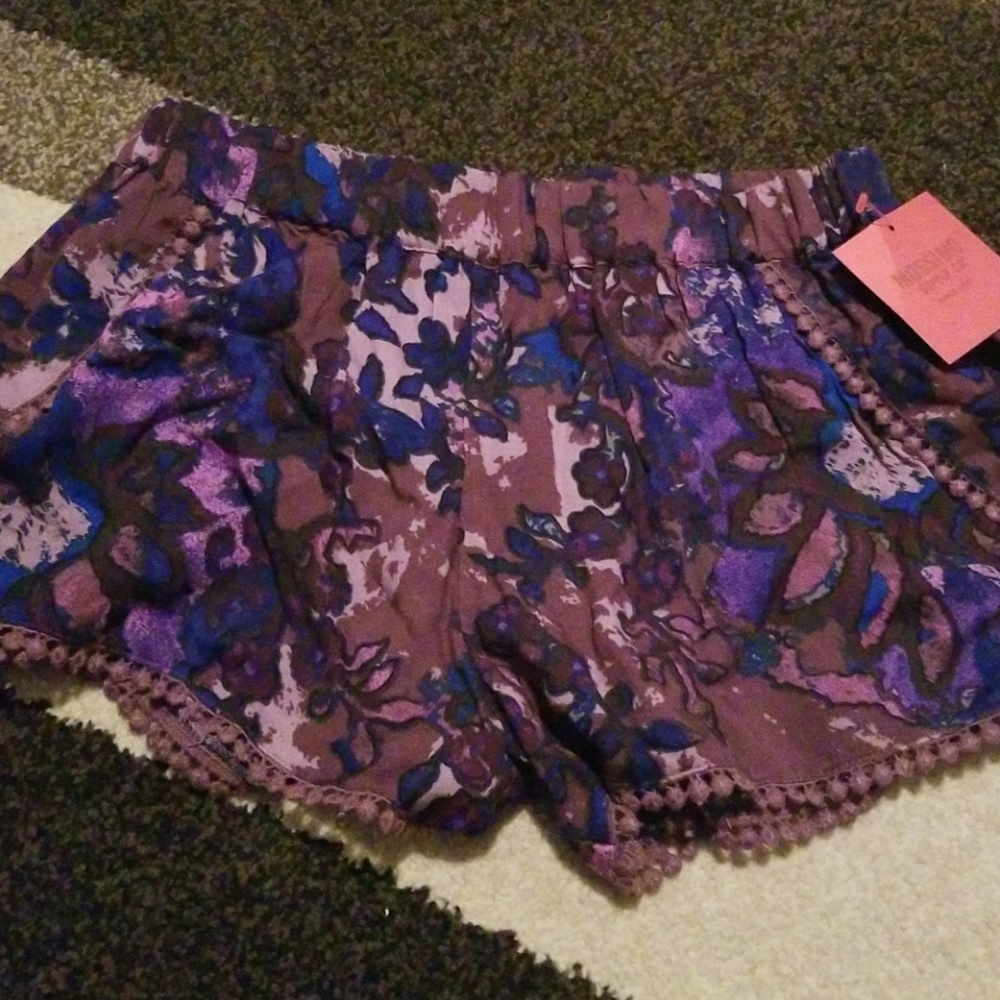Purple/blue loose shorts.